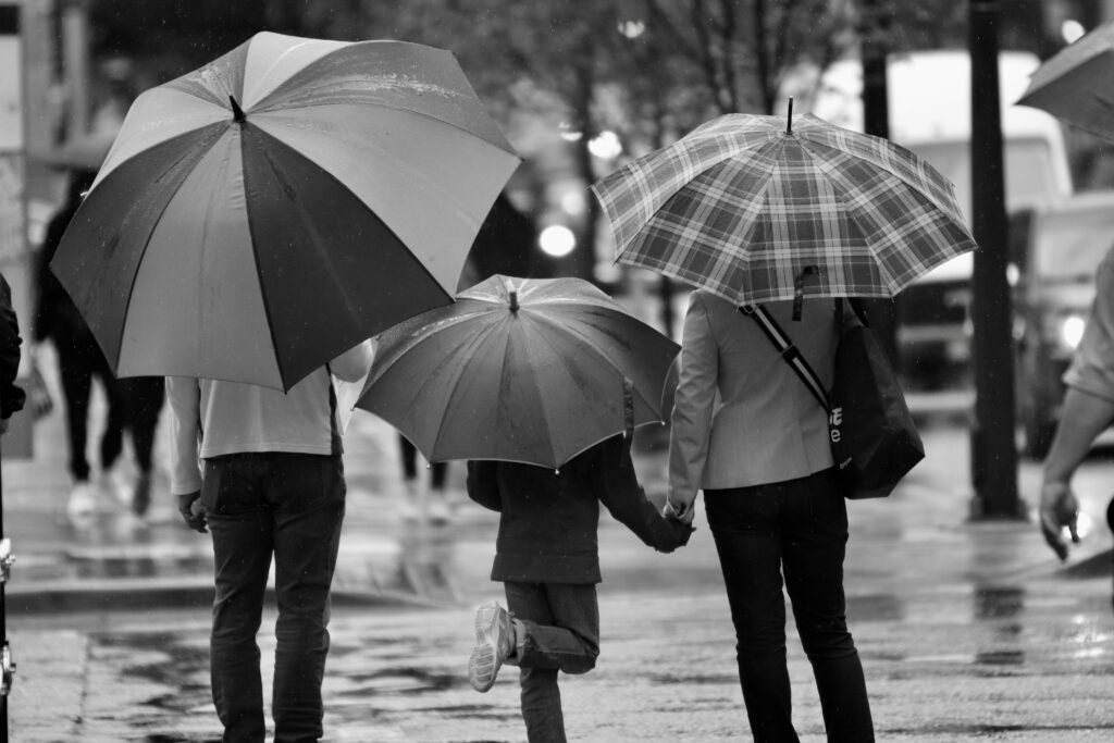 family in rain