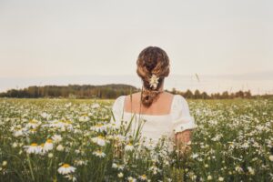 woman in field of flowers