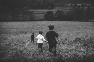 children running in a field